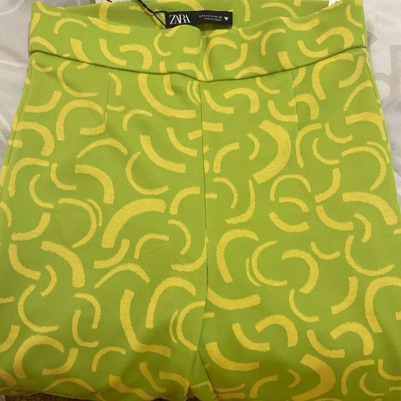 NWT Groovy Zara Flare Fitted Pants in groovy neon shades and pattern - Picture 5 of 7